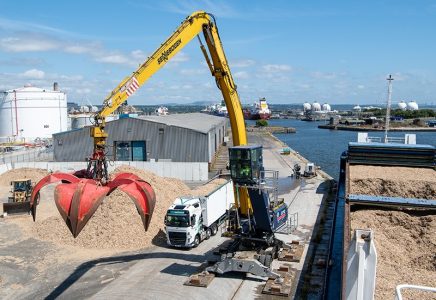 Unloading a vessel of waste wood at Grangemouth Port, Scotland
