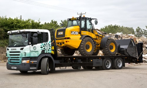 Beaver tail lorry transporting JCB 420